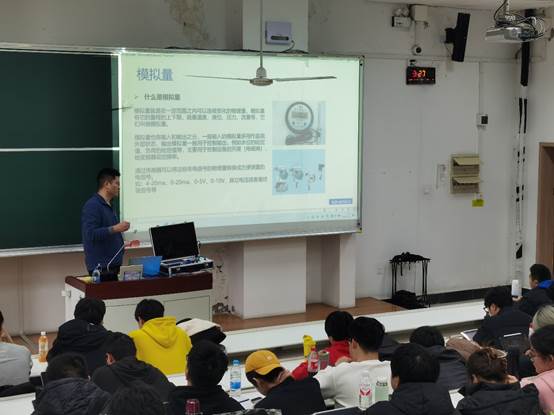 A person standing in front of a screen  AI-generated content may be incorrect.